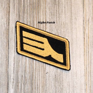 May include: A black and gold embroidered patch with the text "Right Patch" above a stylized wing design.