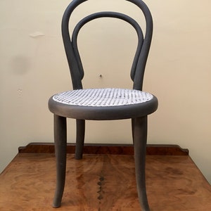 Original antique Thonet labelled child's bentwood chair Number 14 and stamped Made in Wien (Vienna)  in anthracite with caned seat