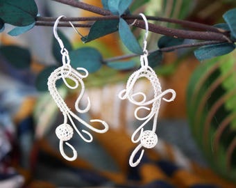 Woven sterling silver asymmetrical design earrings