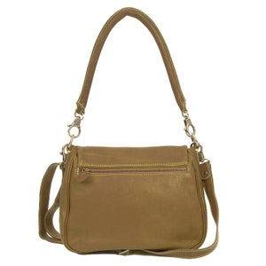 May include: A brown leather shoulder bag with a flap closure and a gold zipper. The bag has a long adjustable strap and a shorter handle.
