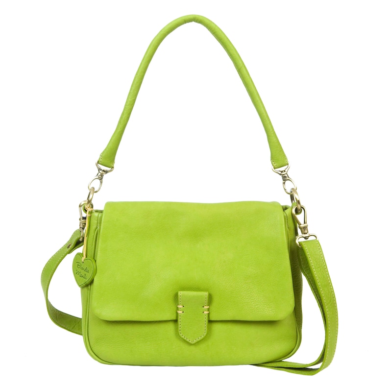 May include: A bright green leather shoulder bag with a flap closure and a small heart-shaped charm that says "Birds Nest".