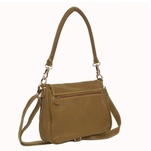May include: A brown leather shoulder bag with a long strap and a flap closure. The bag has a zippered pocket on the back and a gold-toned buckle on the front.