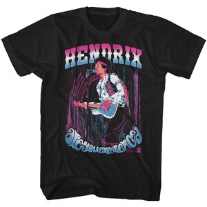 May include: Black t-shirt featuring a colourful graphic of Jimi Hendrix playing guitar. The graphic includes the text "Hendrix" and "Are You Experienced".