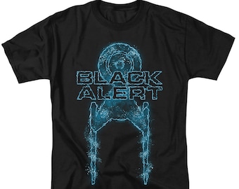 May include: A black short-sleeve t-shirt featuring a glowing blue graphic of a starship silhouette. The text "BLACK ALERT" is printed in a jagged, electric blue font above the ship, which appears to be dissolving into particles of light.