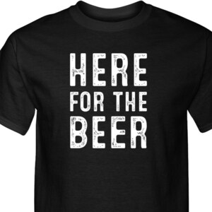 May include: Black t-shirt with white text that reads "Here for the Beer".