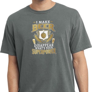 May include: A gray t-shirt with the text "I make beer disappear. What's your superpower?" printed on it. The text is surrounded by a graphic of a beer mug, hops, and wheat.