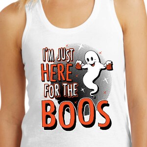 May include: White tank top with a graphic of a ghost holding two beer mugs and the text "I'm just here for the boos".