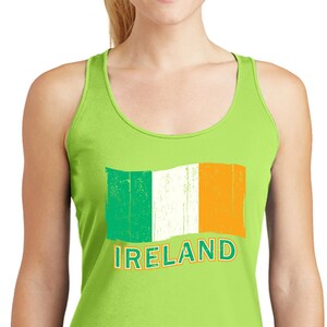 May include: A lime green tank top with a distressed Irish flag and the word "IRELAND" printed on the front.