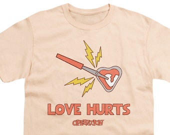 Operation Love Hurts Kid's Cream T-Shirts