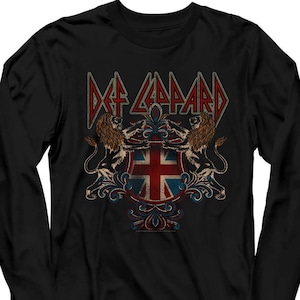 May include: Black long-sleeve t-shirt with a vintage-style graphic of the band Def Leppard. The graphic features the band's name in a bold font with a crest featuring two lions and a Union Jack flag.