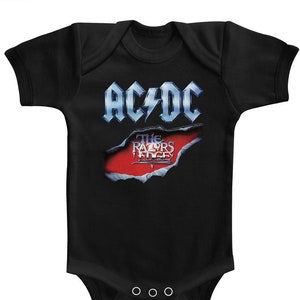 May include: Black baby onesie with a white AC/DC logo and the words "The Razors Edge" in a red box.