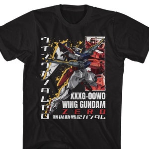 May include: Black t-shirt with a graphic of two robots from the anime series "Gundam Wing". The text "XXG-00WO WING GUNDAM ZERO" is printed on the shirt. The Japanese text "新機動戦記ガンダムW" is also printed on the shirt.