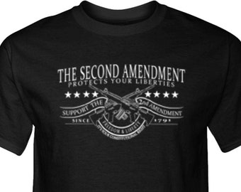 May include: Black t-shirt with a white graphic. The graphic includes the text "THE SECOND AMENDMENT PROTECTS YOUR LIBERTIES" above crossed rifles and stars. Below the rifles is the text "SUPPORT THE 2ND AMENDMENT SINCE 1791".