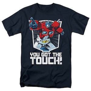 Peut inclure: Un t-shirt bleu marine avec une image de dessin animé d'Optimus Prime, un robot rouge et bleu, avec le texte "You got the touch!" imprimé en blanc.