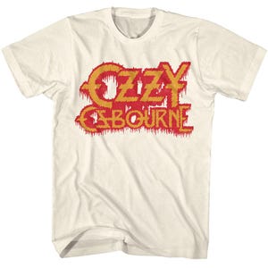 May include: A white t-shirt with a red and yellow "Ozzy Osbourne" logo. The logo is dripping with red paint.