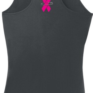 May include: A gray tank top with a pink ribbon and safety pin design on the back.