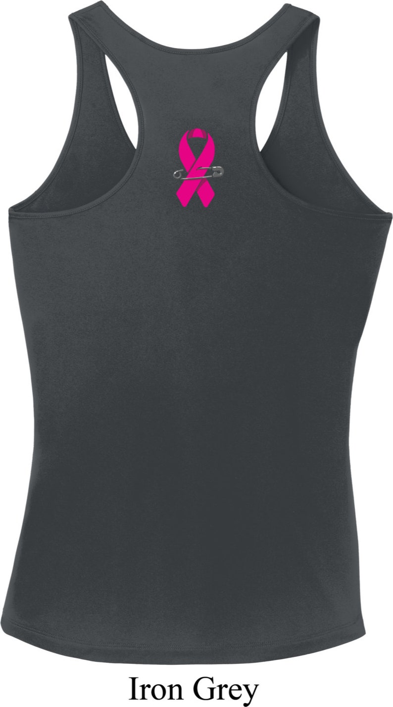 May include: A gray tank top with a pink ribbon and safety pin design on the back.