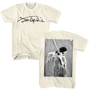May include: A white t-shirt with a black signature that reads "Jimi Hendrix" on the front. The back of the shirt features a black and white photo of Jimi Hendrix playing a guitar.
