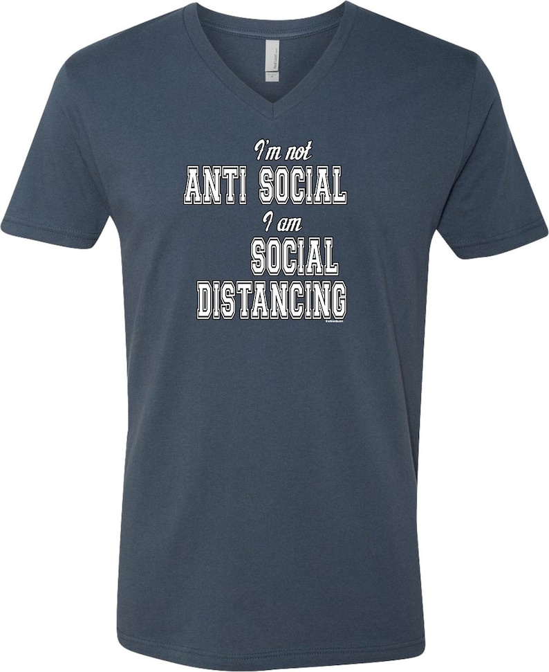 May include: A dark blue v-neck t-shirt with the text "I'm not anti social I am social distancing" in white.