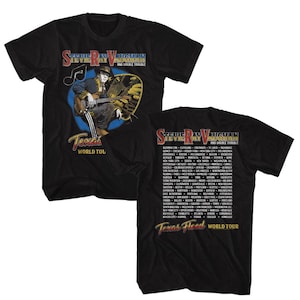 May include: Black t-shirt featuring a graphic of Stevie Ray Vaughan playing guitar, with the text "Stevie Ray Vaughan and Double Trouble" and "Texas World Tour." The back of the shirt lists tour cities.