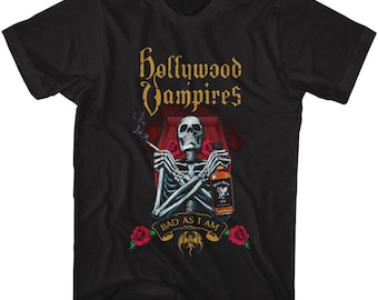 May include: Black t-shirt featuring a graphic of a skeleton in a coffin holding a bottle of whiskey and a cigarette. The text "Hollywood Vampires" and "Bad As I Am" is printed on the shirt.