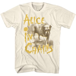 May include: A white t-shirt with a faded image of a dog and the text "Alice in Chains" in yellow.