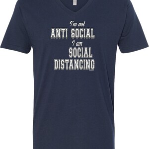 May include: Navy blue v-neck t-shirt with white text that reads "I'm not anti social I am social distancing".