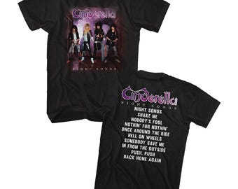 May include: Black t-shirt with a band logo for the rock band Cinderella. The logo is in purple and white and says "Cinderella Night Songs". The front of the shirt features a photo of the band members. The back of the shirt has the band's name and the song titles from their album "Night Songs".