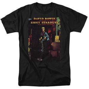 May include: Black t-shirt featuring the album art for David Bowie's "Ziggy Stardust." The graphic shows Bowie in a colorful outfit, holding a guitar, with the album title and artist's name in white text.