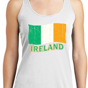May include: White tank top with a distressed Irish flag graphic and the word "IRELAND" printed below.