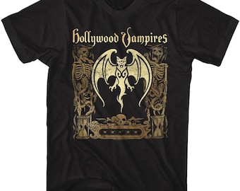 May include: Black t-shirt with the words "Hollywood Vampires" in gold script. The design features a bat-like creature with wings, skeletons, and skulls, all in a gothic style.