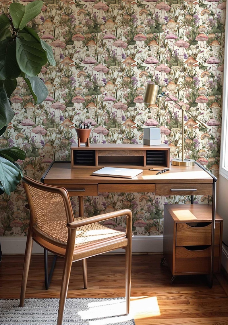 May include: A home office featuring a wooden desk and chair, a lamp, and a filing cabinet. The wall is adorned with wallpaper featuring a mushroom and floral design.