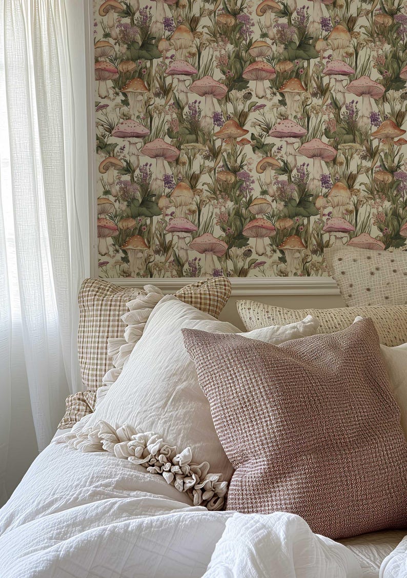 May include: A bedroom with a white bed and pillows. The wall behind the bed is covered in wallpaper with a mushroom and floral pattern.