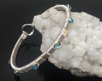 Swiss Blue Topaz Wire Wrap Bracelet Argentium Silver and 14 karat yellow gold filled woven bracelet design by Ryan Eure Designs