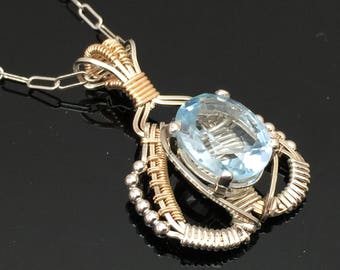 Orion Design Blue topaz Charm Pendent Argentium Silver and 14 karat yellow gold filled wire wrap designs by Ryan Eure