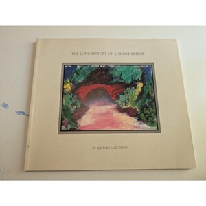 May include: A book titled "THE LONG HISTORY OF A SHORT BRIDGE" by Richard Samuelson. The cover features a colorful painting of a red bridge surrounded by green foliage and a pink path.