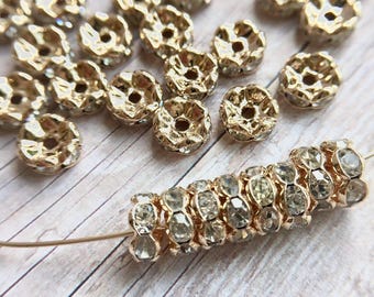 7mm AAA grade clear rhinestone crystal rondelle brass spacer, light gold tone spacer, wavy edge, six crystals, 20 pieces