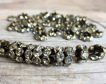 6mm AAA grade clear rhinestone crystals rondelle brass spacer, antique bronze tone brass, wavy edge, six crystals, 20 pieces