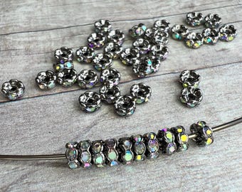 Rare 4mm AAA grade rhinestone crystals AB rondelle brass spacer bead, wavy edge, gun metal color brass, six crystals, 20 pieces