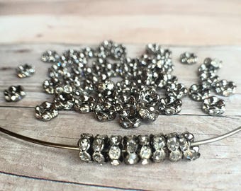 5mm AAA grade clear rhinestone crystals rondelle brass spacer, wavy edge, gun metal color brass, six crystals, 20 pieces