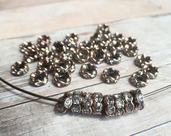 6mm AAA grade clear rhinestone crystals rondelle brass spacer, wavy edge, red copper color brass, six crystals, 20 pieces