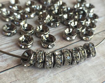 6mm AAA grade clear rhinestone crystals rondelle brass spacer, straight edge, gun metal color brass, six crystals, 20 pieces