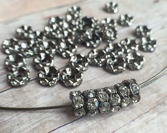 7mm AAA grade clear rhinestone crystals rondelle brass spacer, wavy edge, gun metal color brass, six crystals, 20 pieces