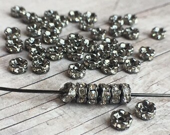 4mm AAA grade clear rhinestone crystals rondelle brass spacer, wavy edge, gun metal color brass, six crystals, 20 pieces
