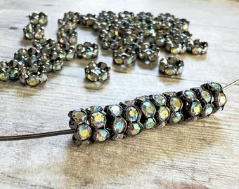 Rare 7mm AAA grade rhinestone crystals AB rondelle brass spacer, wavy edge, gun metal color brass, six crystals, 20 pieces