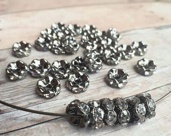 8mm AAA grade clear rhinestone crystals rondelle brass spacer, wavy edge, gun metal color brass, six crystals, 20 pieces
