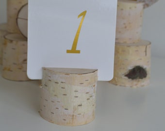 Set of 12 table number holders and 2 pen holders.