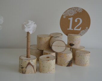 Set of 12 table number holders and 2 pen holders.