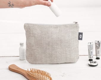 Medium white linen zip pouch for travel cosmetics. Canvas vegan makeup bag for women, men. Washable eco friendly toiletry zipper bag