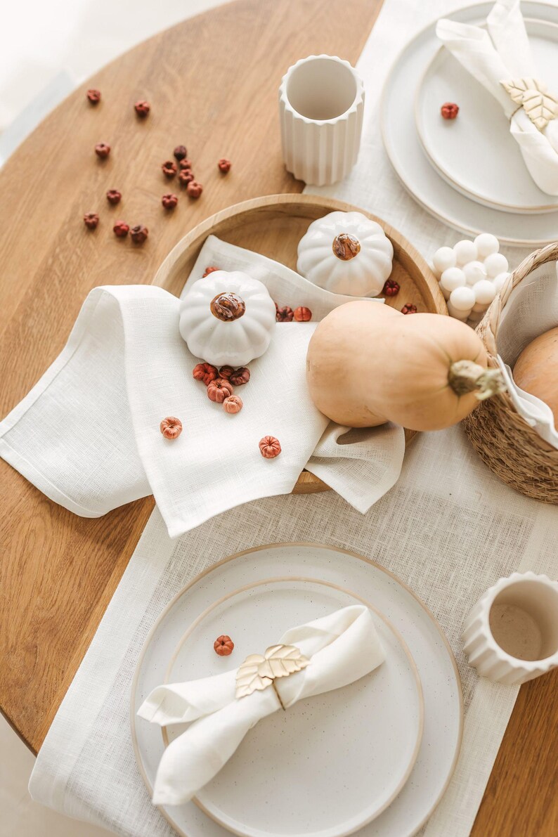 White natural linen table runner styled for a rustic farmhouse dining table